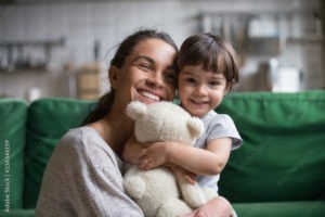 smiling single young mum embracing little preschool daughter with toy playing in living room at home mother laughing with child headshot portrait cute girl look at camera stockpack adobe stock 300x200 - 5 Can't Miss Tips on Auto Insurance To Rack Up The Savings