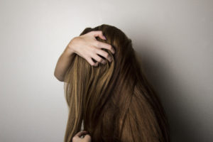 photo of woman covering face with her hair stockpack pexels 300x200 - Hair Care For Anyone With Any Hair Type