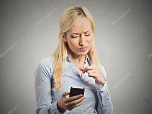 angry young business woman pointing with finger at smartphone stockpack deposit photos 300x224 - Five Words To Avoid at Job Interviews